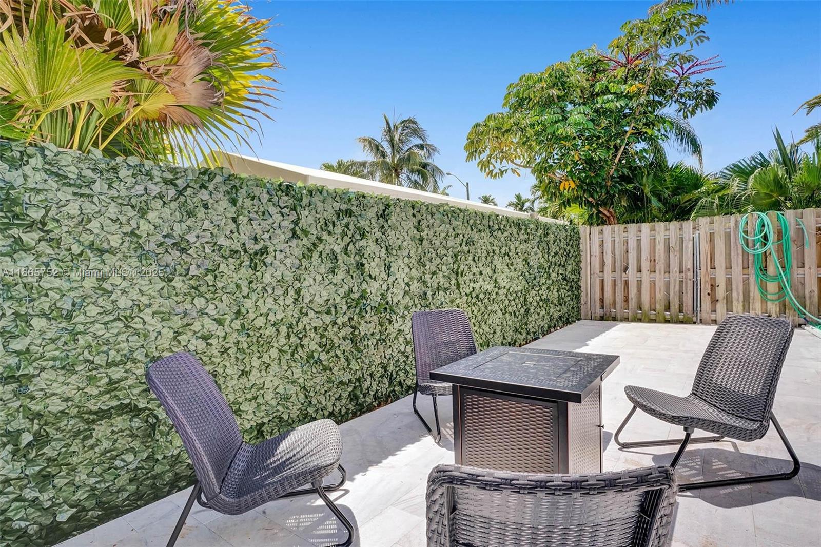 3421 Dover Road Pompano Beach, FL 33062 - Photo 64 of 83 a view of a chairs and table in the patio