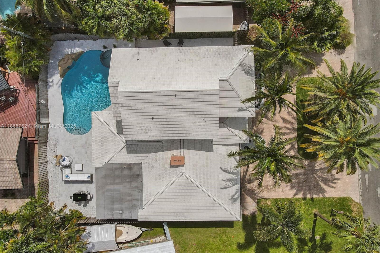 3421 Dover Road Pompano Beach, FL 33062 - Photo 77 of 83 an aerial view of residential houses with outdoor space and trees