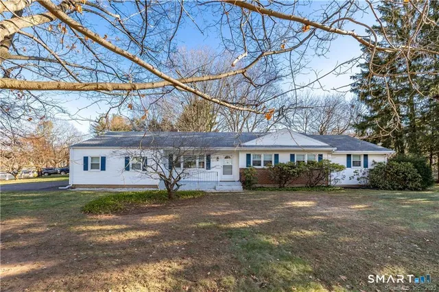 a view of a house with a yard