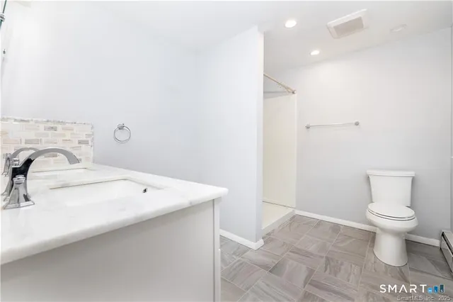 a view of a bathroom with a sink and a toilet