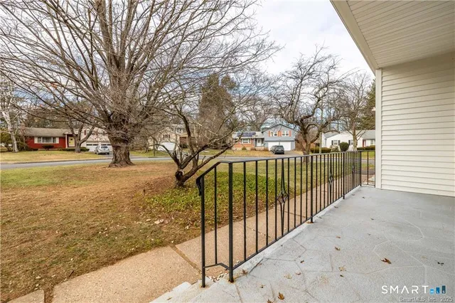 a view of a pathway with a yard