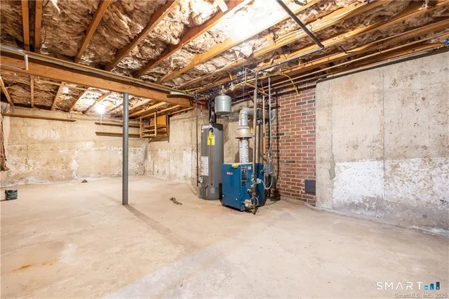 a view of a utility room with wooden floor