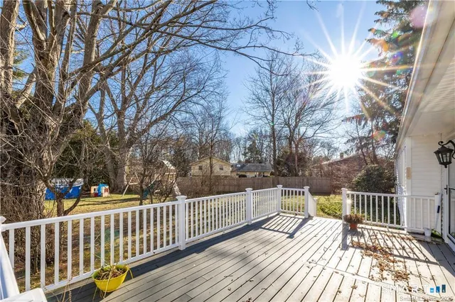 a view of a balcony with wooden floor