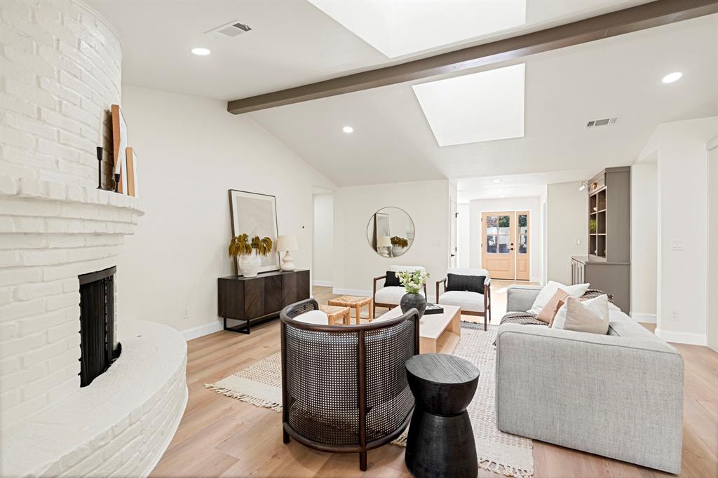 9376 Briarhurst Drive Dallas, TX 75243 - Photo 14 of 38 a living room with fireplace furniture and a wooden floor