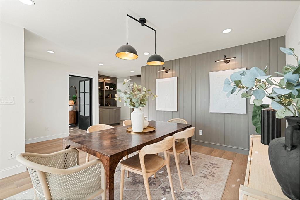 9376 Briarhurst Drive Dallas, TX 75243 - Photo 16 of 38 a dining room with furniture potted plants and wooden floor