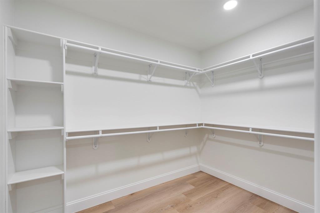9376 Briarhurst Drive Dallas, TX 75243 - Photo 26 of 38 a view of an empty walk in closet