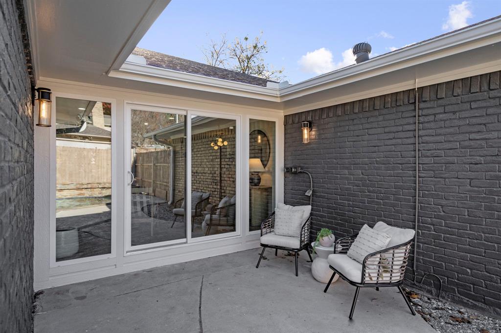 9376 Briarhurst Drive Dallas, TX 75243 - Photo 34 of 38 a view of a patio with a chairs and a barbeque