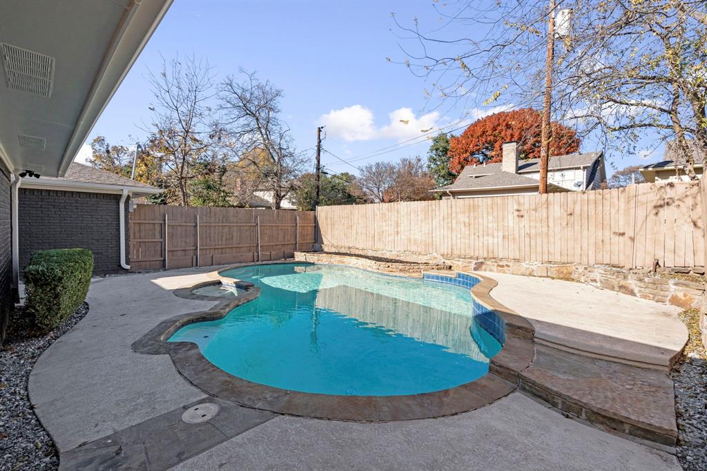 9376 Briarhurst Drive Dallas, TX 75243 - Photo 37 of 38 a view of a swimming pool with a patio and a yard