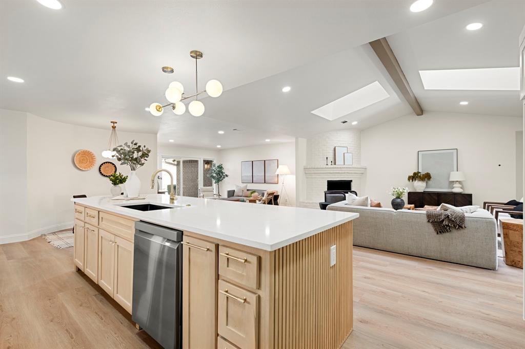 9376 Briarhurst Drive Dallas, TX 75243 - Photo 9 of 38 a kitchen with a sink and a stove top oven