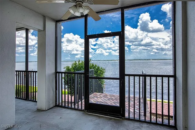 a kitchen with stainless steel appliances granite countertop a sink refrigerator and cabinets