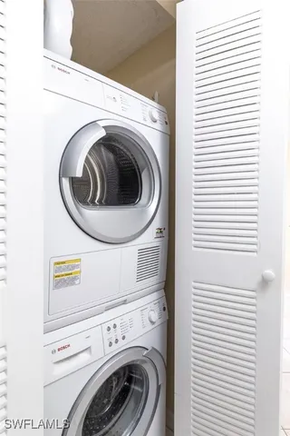 a living room with lots of furniture and a large window