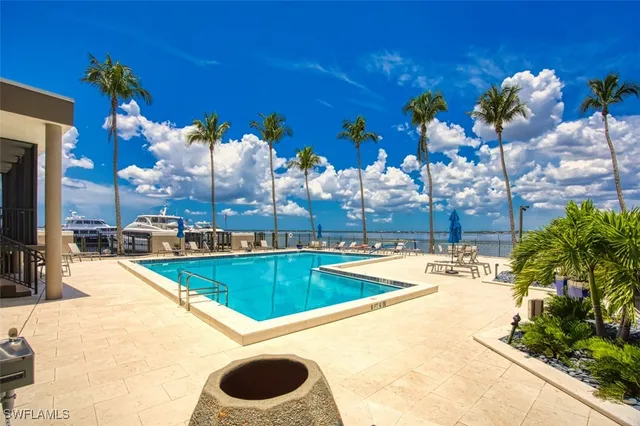 a view of a swimming pool with a lounge chairs