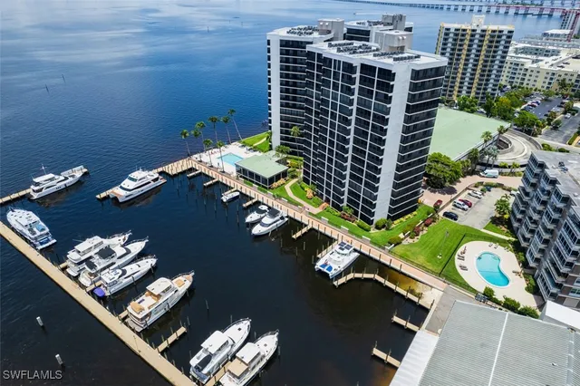 a view of backyard with swimming pool and outdoor seating
