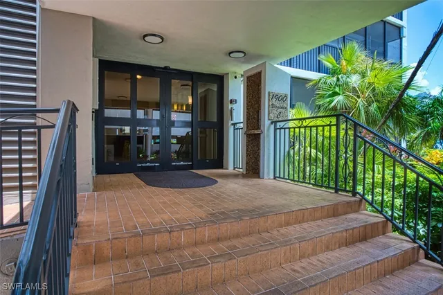 a view of a room with furniture and window