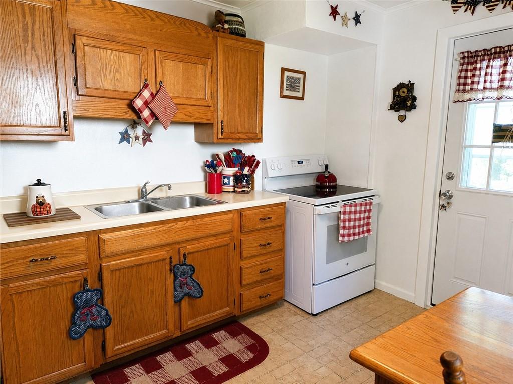 741 Center Avenue Butler, PA 16001 - Photo 3 of 27 a kitchen with stainless steel appliances a sink a stove and a window