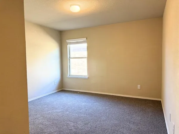 an empty room with a empty space and a window