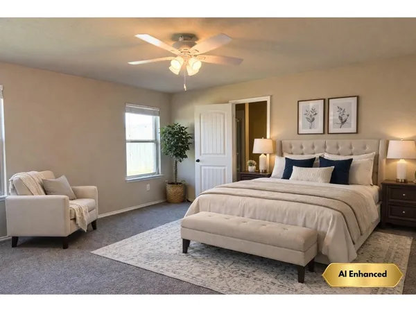 a spacious bedroom with a bed and a chandelier