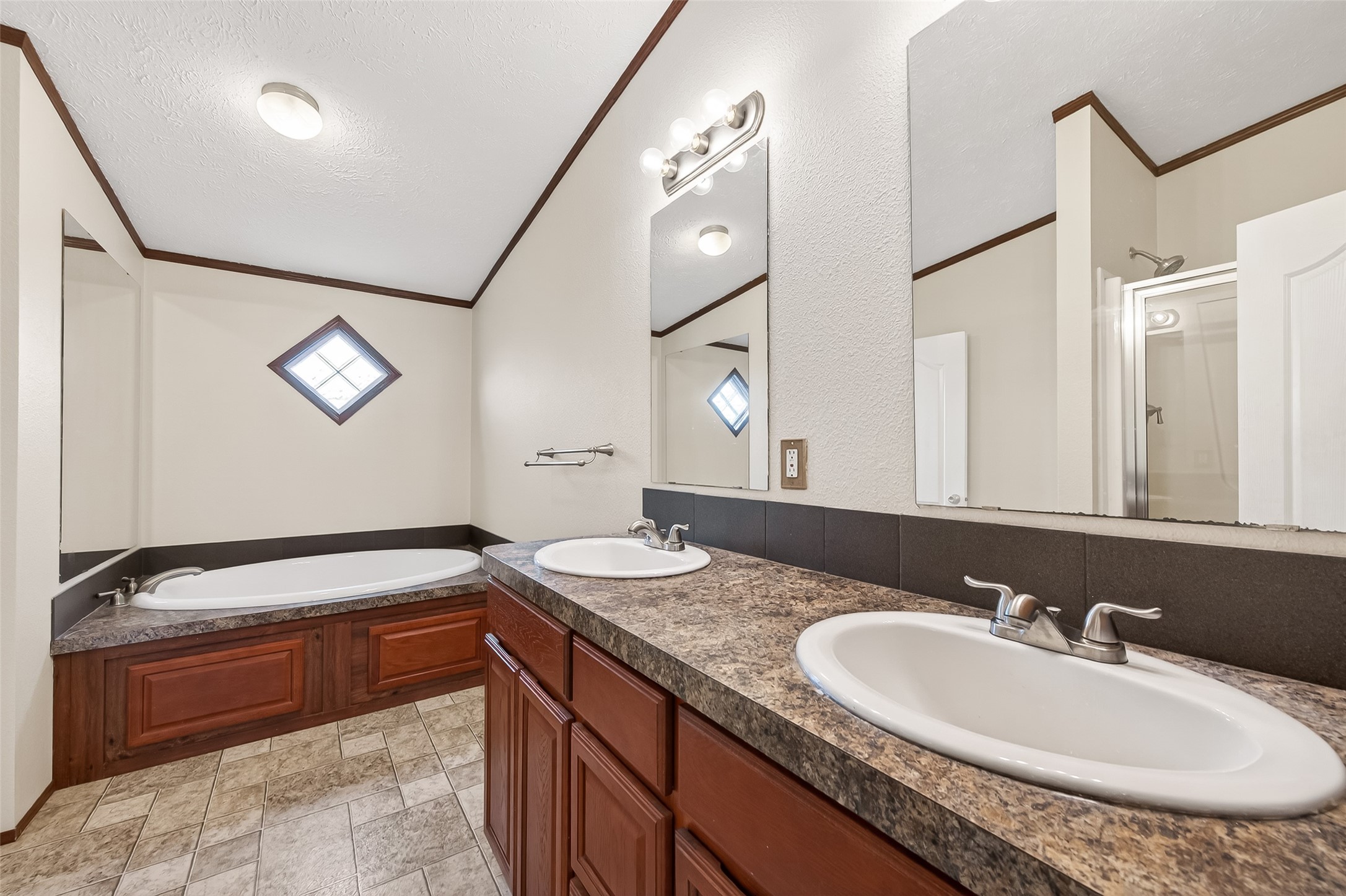 9820 Oberrender Road Needville, TX 77461 - Photo 19 of 30 a bathroom with a granite countertop sink and a mirror