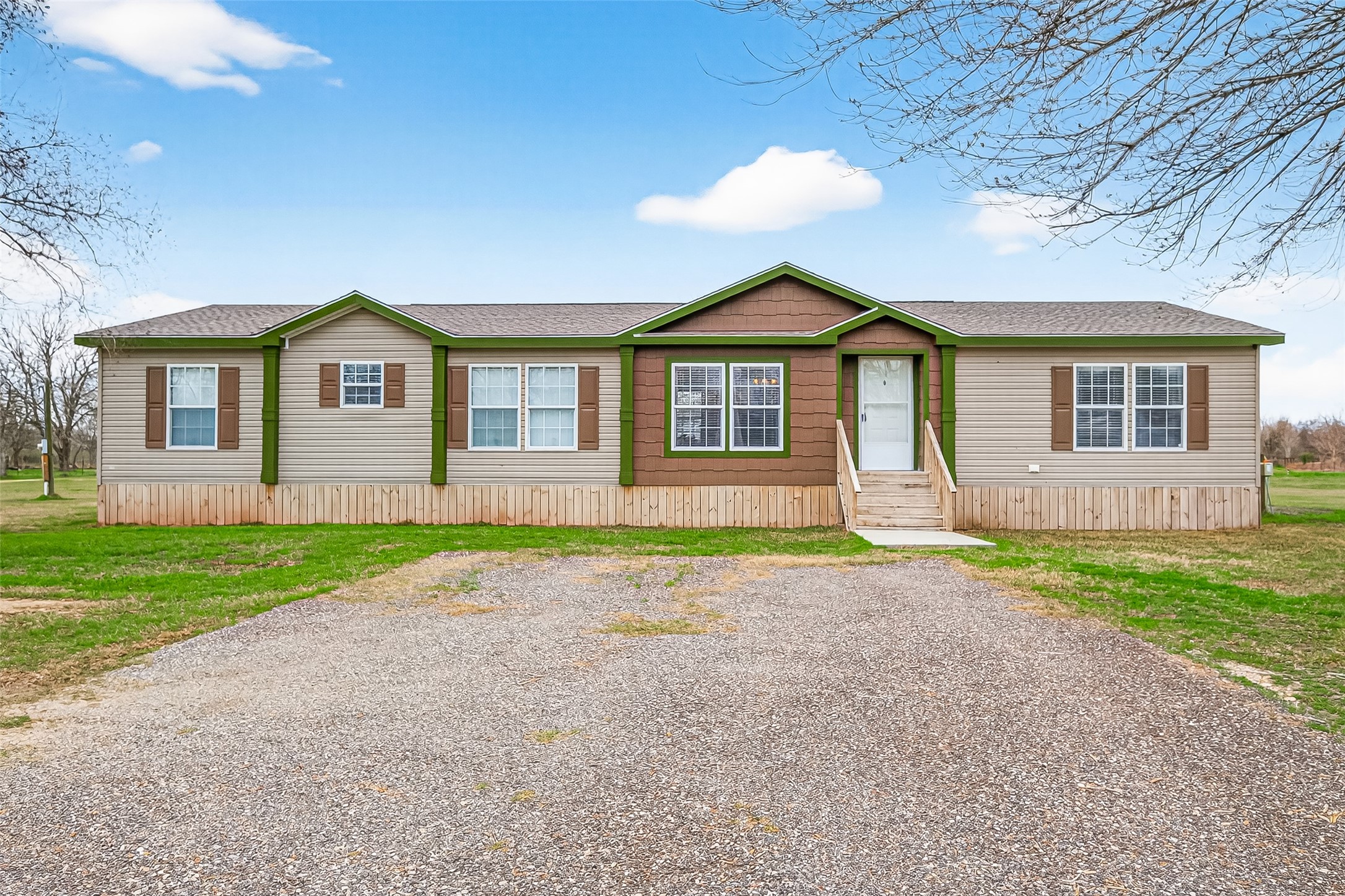 9820 Oberrender Road Needville, TX 77461 - Photo 6 of 30 a front view of a house with a yard and garage