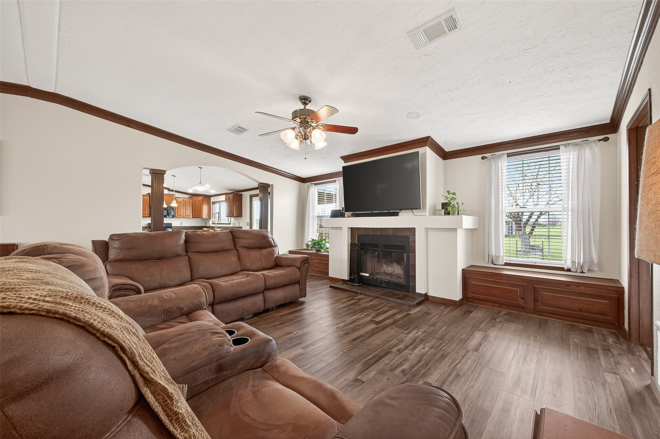 9820 Oberrender Road Needville, TX 77461 - Photo 10 of 30 a living room with furniture a fireplace and a flat screen tv