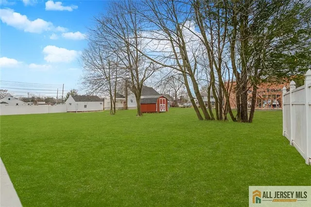 a view of a park with large trees