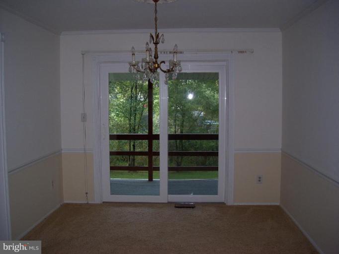 113 Circle Road Pasadena, MD 21122 - Photo 7 of 7 DINING DECK OFF DINING ROOM