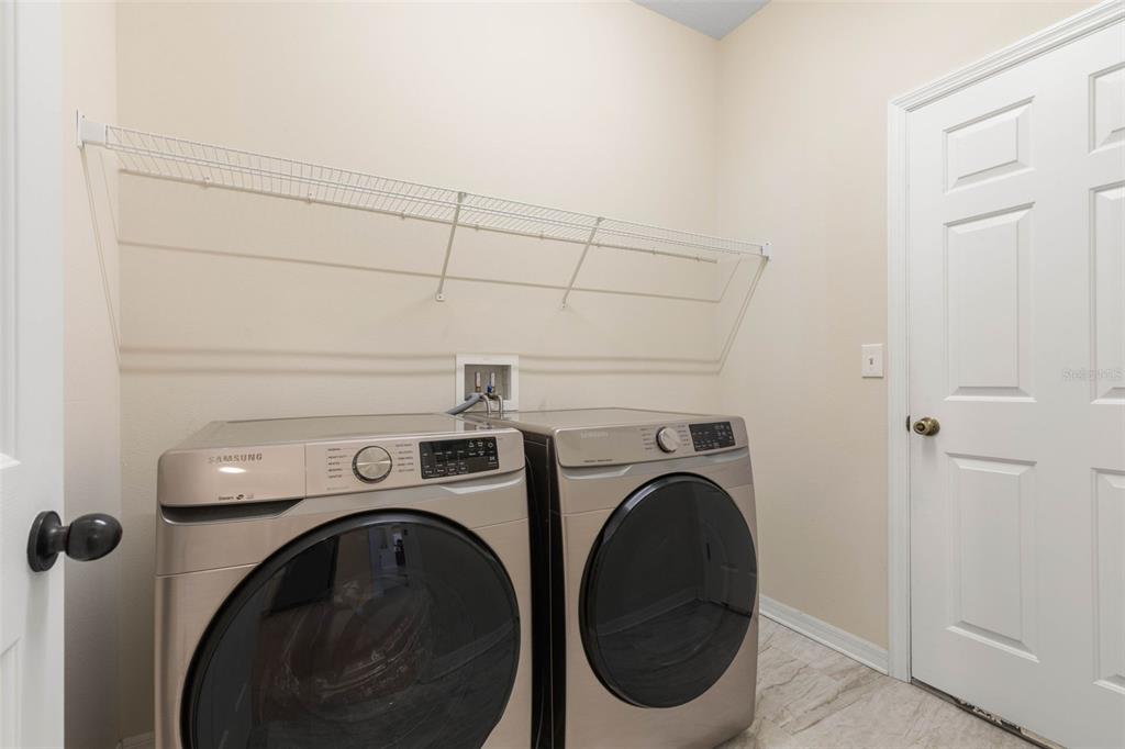20 Rybar Lane Palm Coast, FL 32164 - Photo 26 of 40 a utility room with dryer and washer