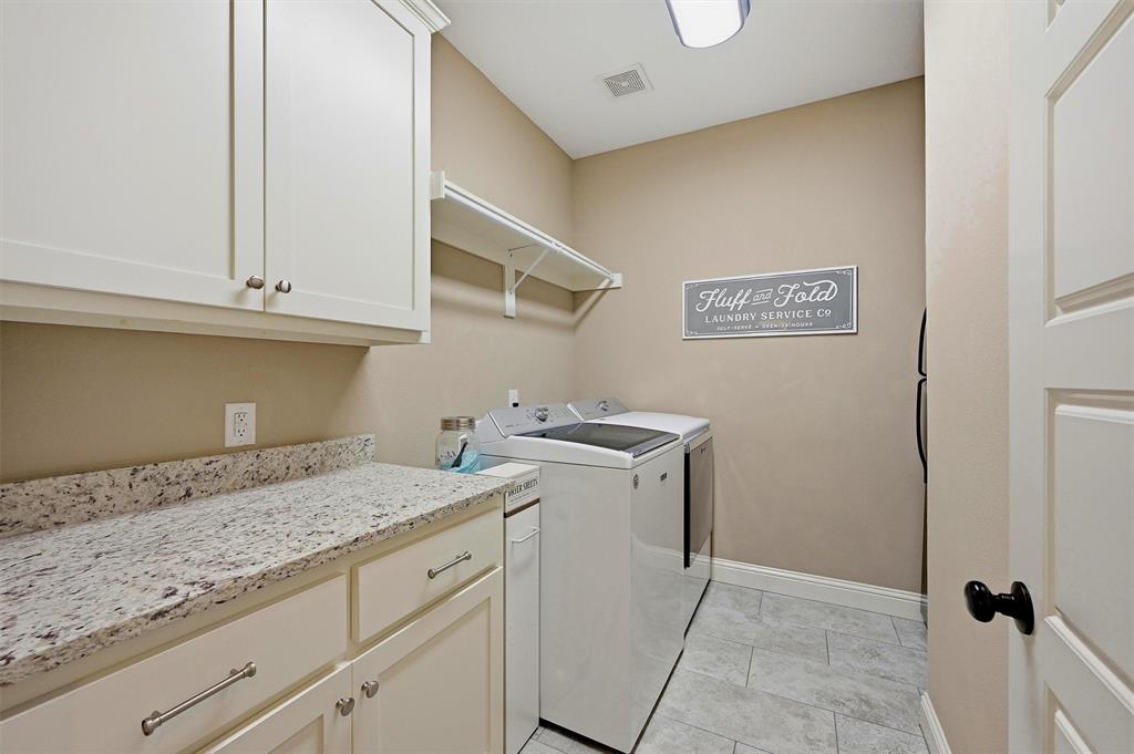 662 Preakness Place Road Van Alstyne, TX 75495 - Photo 20 of 39 a view of a storage and utility room with washer and dryer