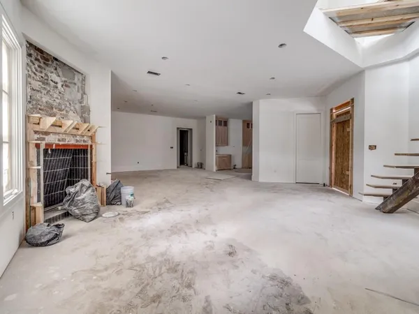 a view of a livingroom with furniture and a fireplace