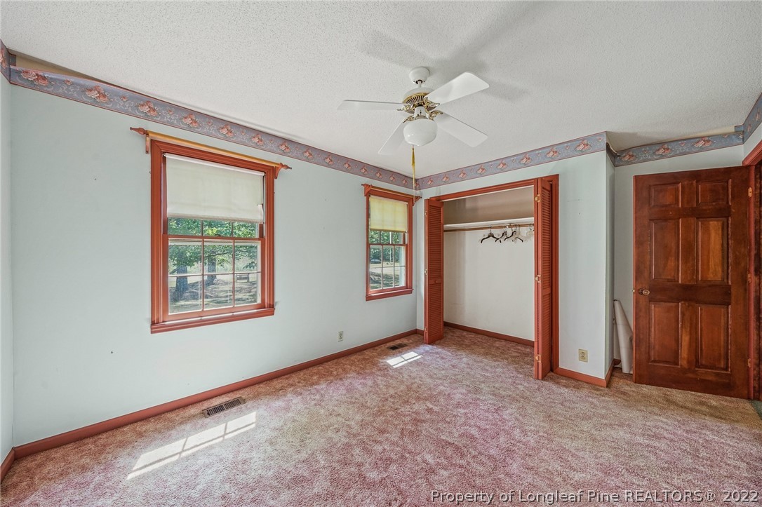 2256 Tew Road Godwin, NC 28344 - Photo 24 of 47 a view of an empty room with a window