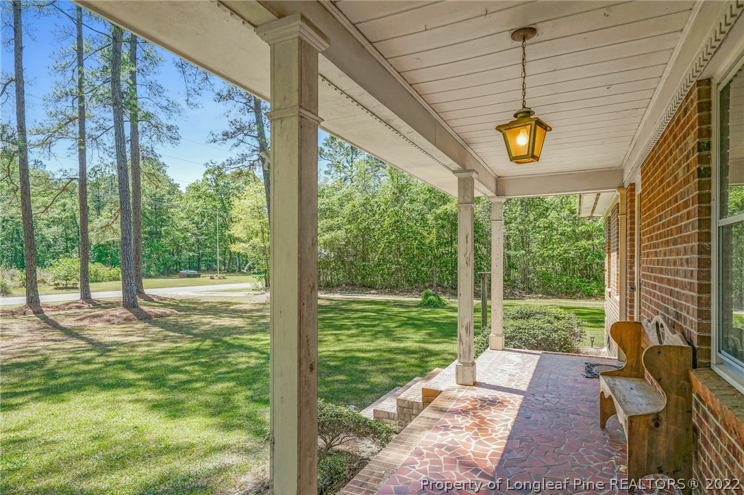 2256 Tew Road Godwin, NC 28344 - Photo 3 of 47 a view of a porch and garden