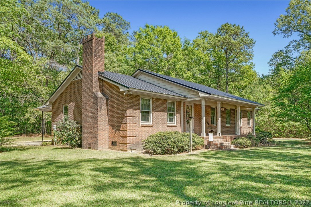 2256 Tew Road Godwin, NC 28344 - Photo 4 of 47 a front view of a house with a yard