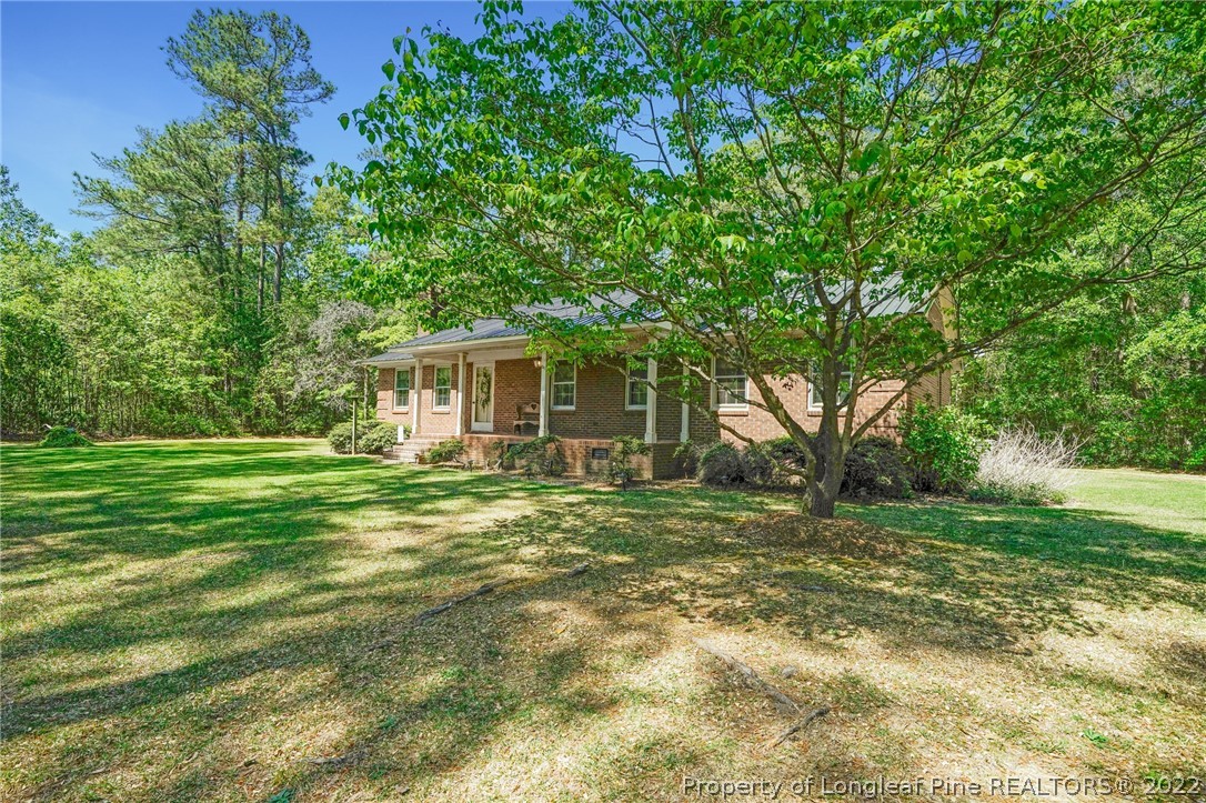 2256 Tew Road Godwin, NC 28344 - Photo 5 of 47 a view of a house with a backyard