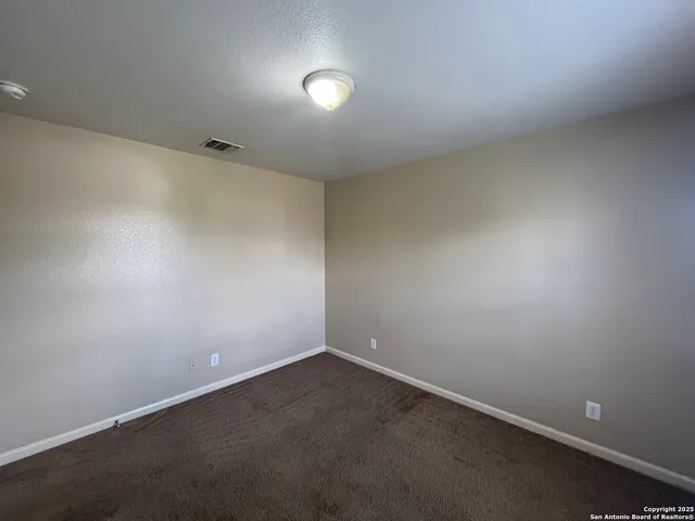 an empty room with a empty space and window