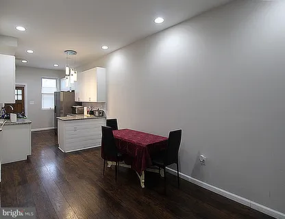 a kitchen with a table and chairs in it