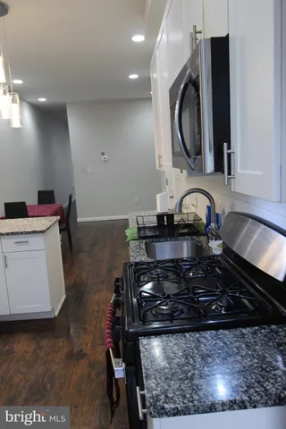 a kitchen with a stove and a sink