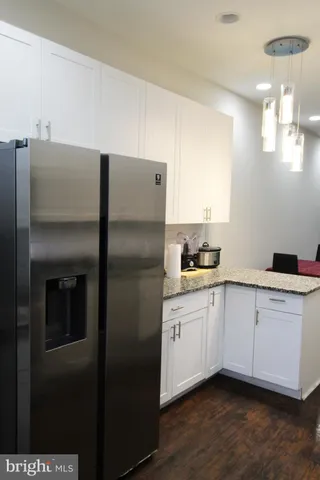 a kitchen with stainless steel appliances a refrigerator and a sink