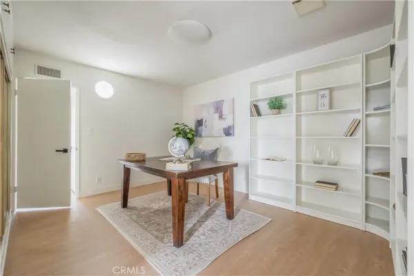 a bed room with a bed and a chair
