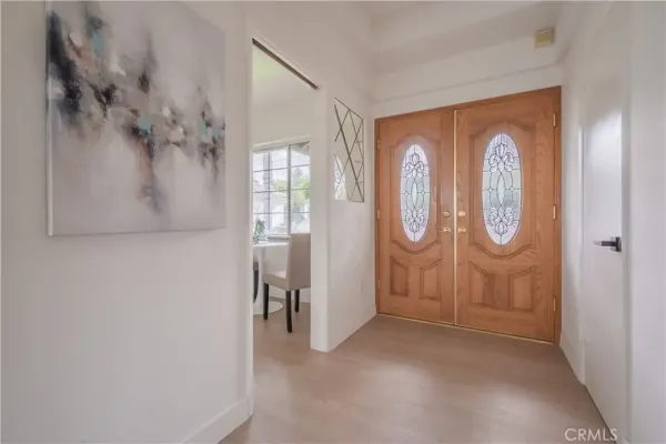 a view of a dining room with furniture and a large window