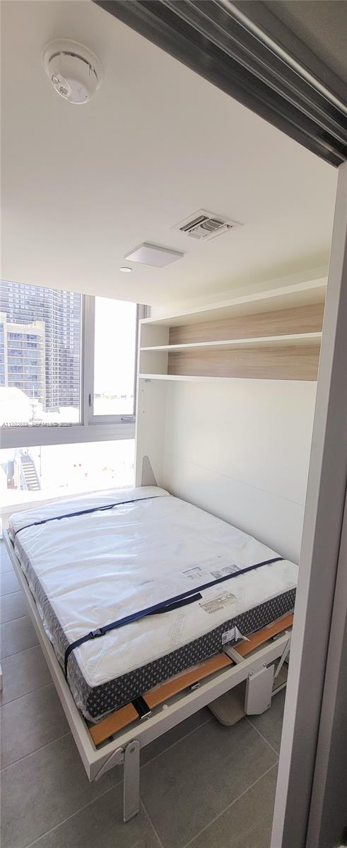 227 Northeast 2nd Street, Unit 2907 Miami, FL 33132 - Photo 12 of 58 a view of a room with wooden floor