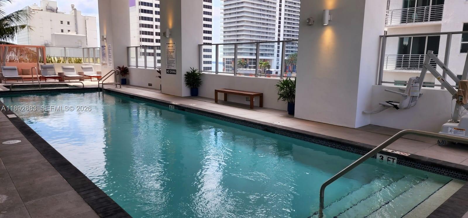 227 Northeast 2nd Street, Unit 2907 Miami, FL 33132 - Photo 26 of 58 a view of swimming pool from a balcony