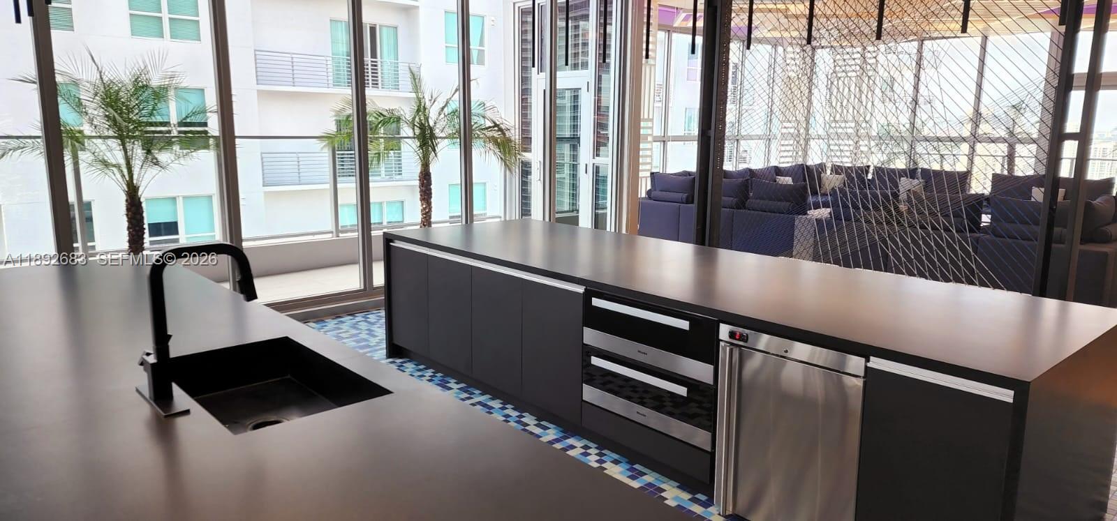 227 Northeast 2nd Street, Unit 2907 Miami, FL 33132 - Photo 53 of 58 a hallway with a large window and furniture