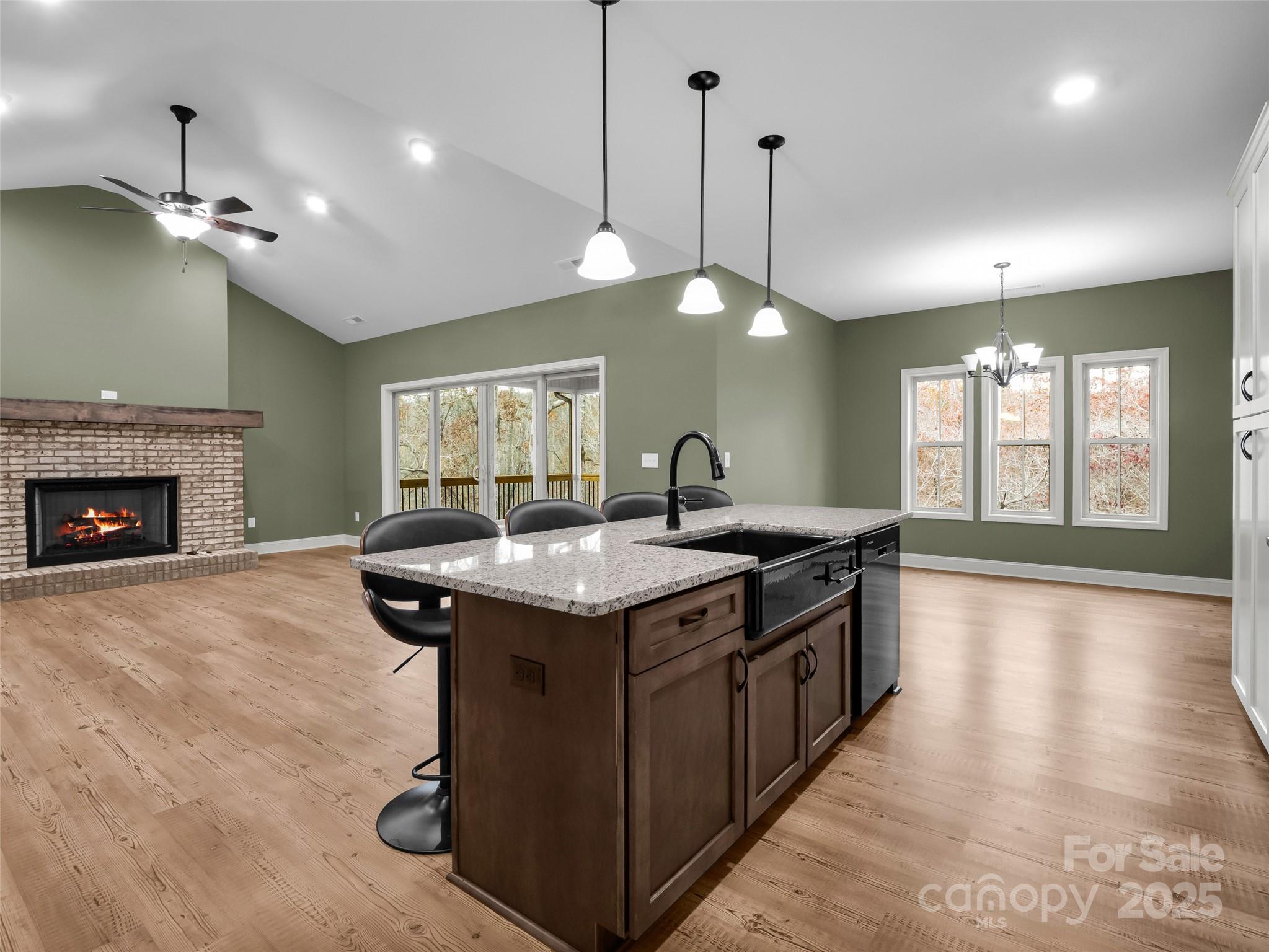 140 Cv Crst Drive Rutherfordton, NC 28139 - Photo 14 of 48 a kitchen with a stove and a wooden floor