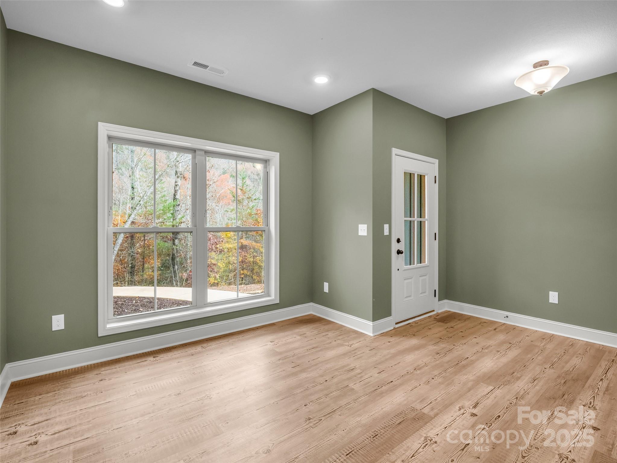140 Cv Crst Drive Rutherfordton, NC 28139 - Photo 5 of 48 wooden floor in an empty room with a window