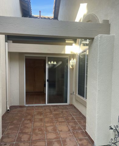 a view of a hallway with wooden shelves