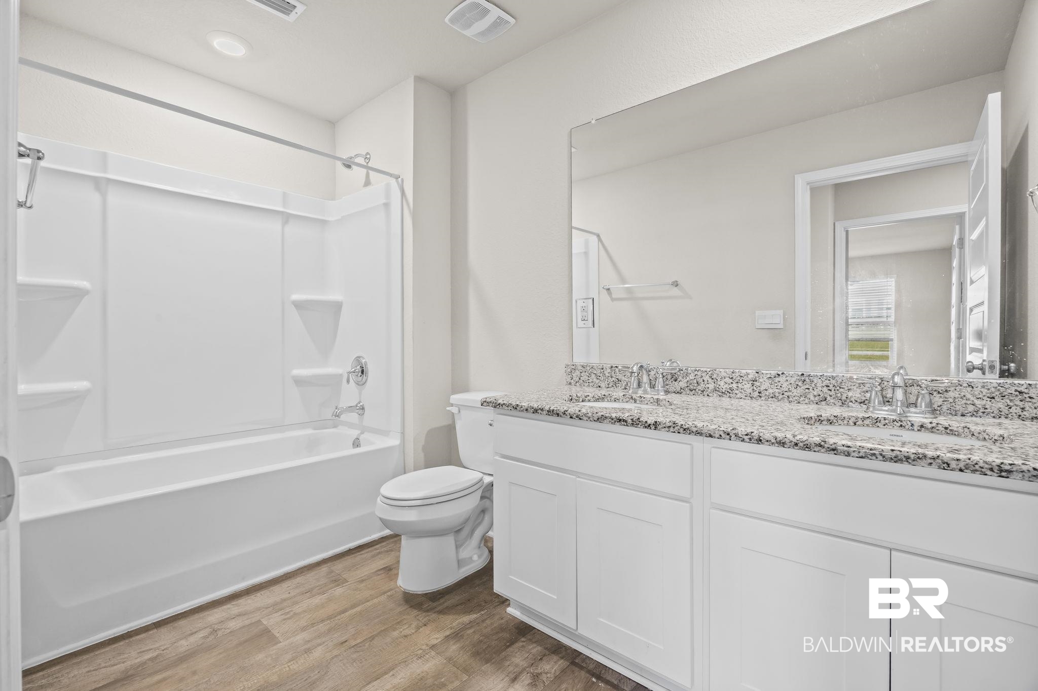 3090 Camino Real Loop Lillian, AL 36549 - Photo 18 of 29 Bathroom featuring double vanity, light wood finished floors, and shower / bathtub combination