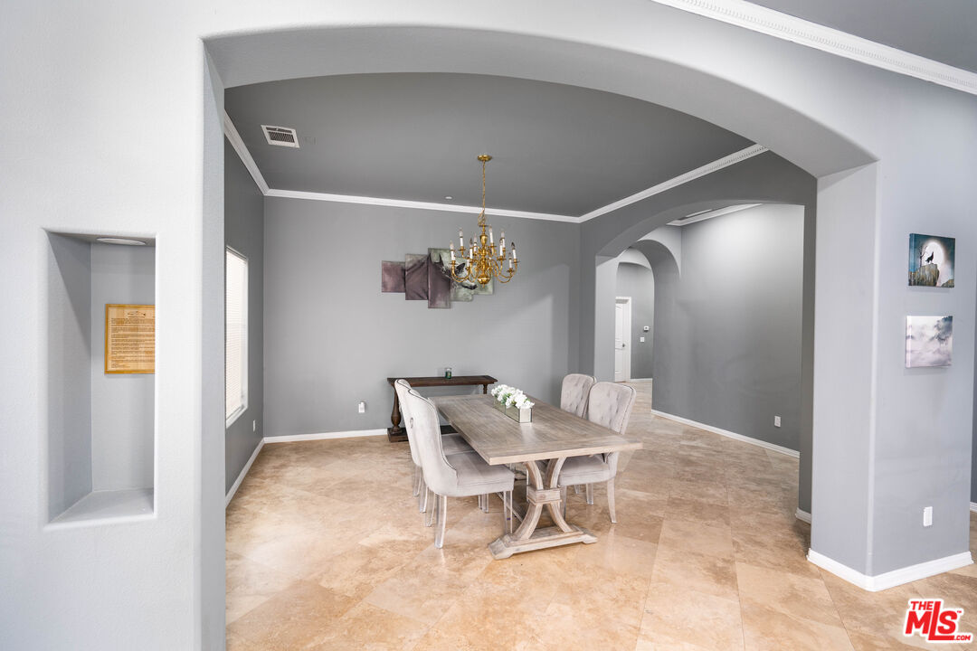 34545 Juniper Valley Road Acton, CA 93510 - Photo 11 of 34 a view of a hallway with wooden floor and a refrigerator