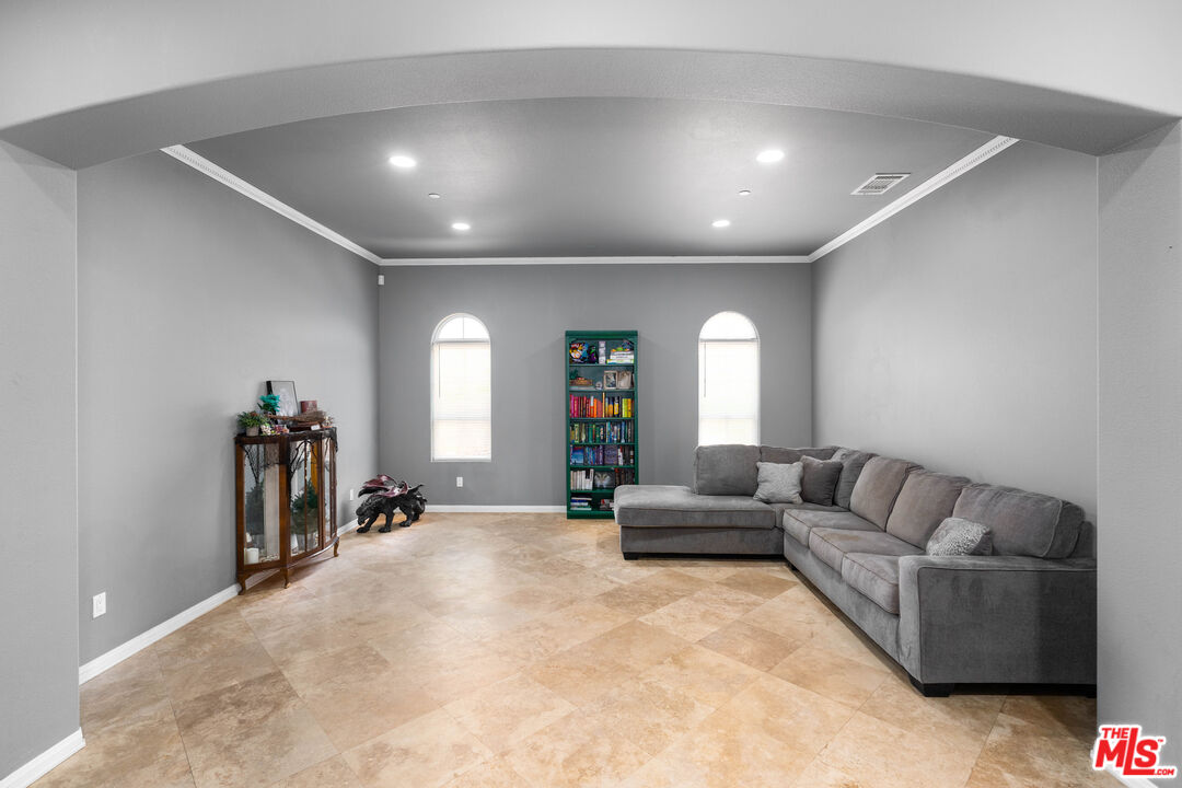 34545 Juniper Valley Road Acton, CA 93510 - Photo 12 of 34 a living room with furniture and a large mirror next to a window