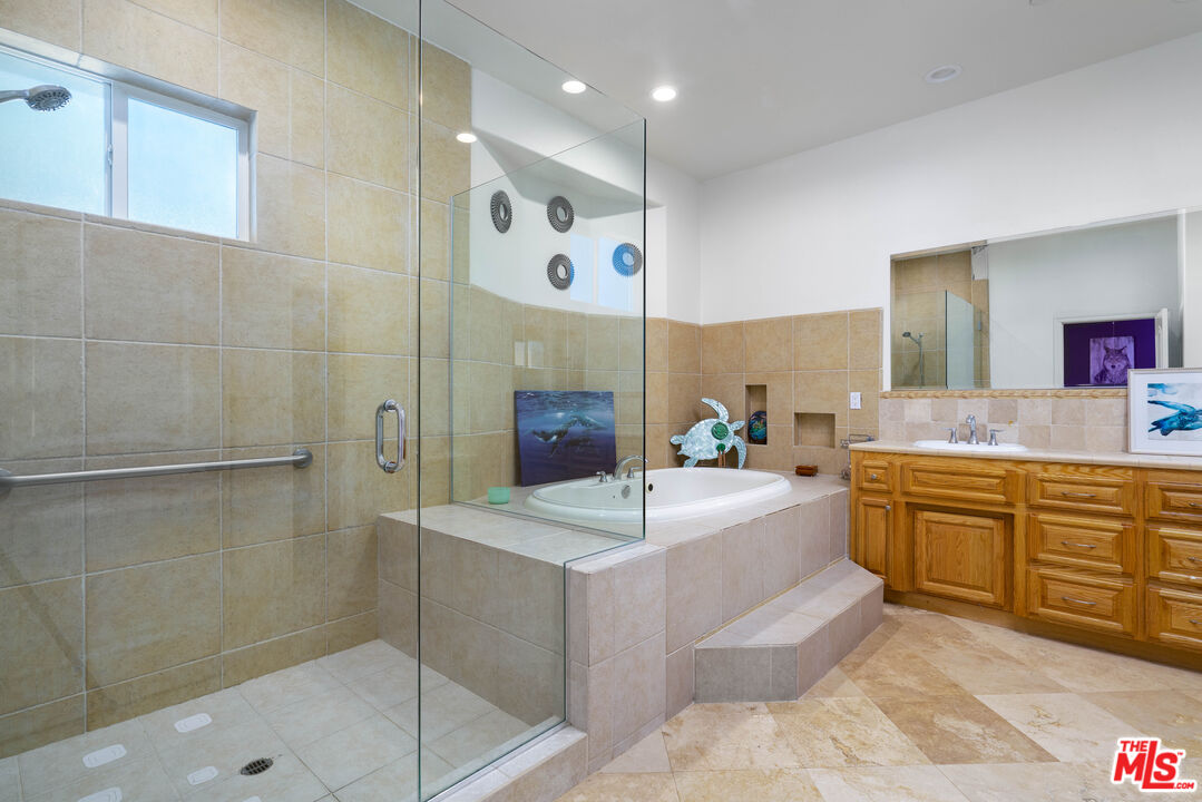 34545 Juniper Valley Road Acton, CA 93510 - Photo 16 of 34 a large bathroom with a sink a large mirror and shower