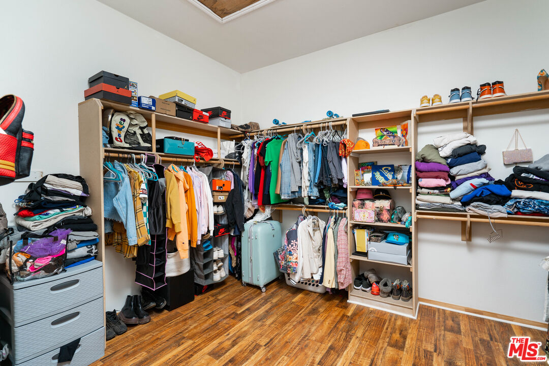 34545 Juniper Valley Road Acton, CA 93510 - Photo 18 of 34 a view of walk in closet with clothes and shoes
